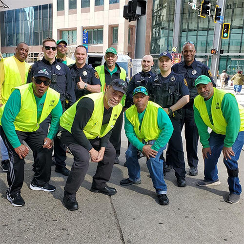 Some Mad Dads volunteers posing with police officers